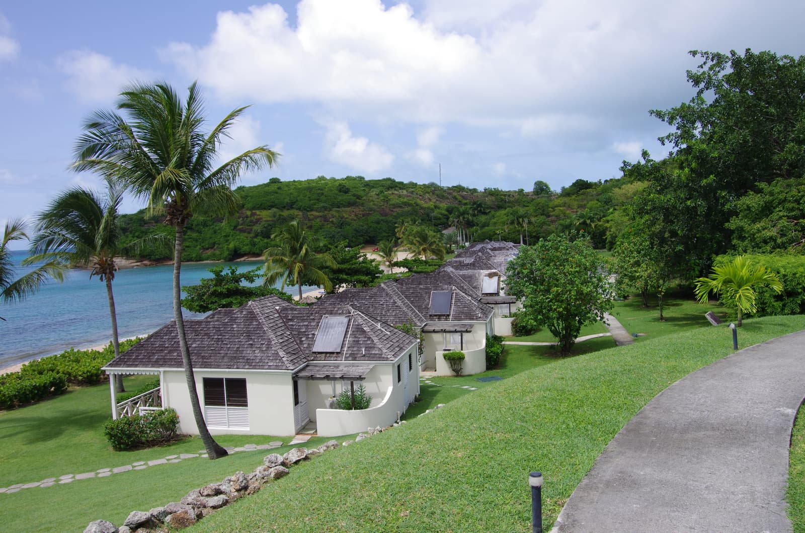 Beachfront cottages above the bay at Hawksbill, Antigua